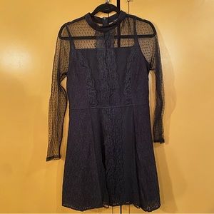 River Island brand black lace high neck long sleeved mini dress. Size 10 US.